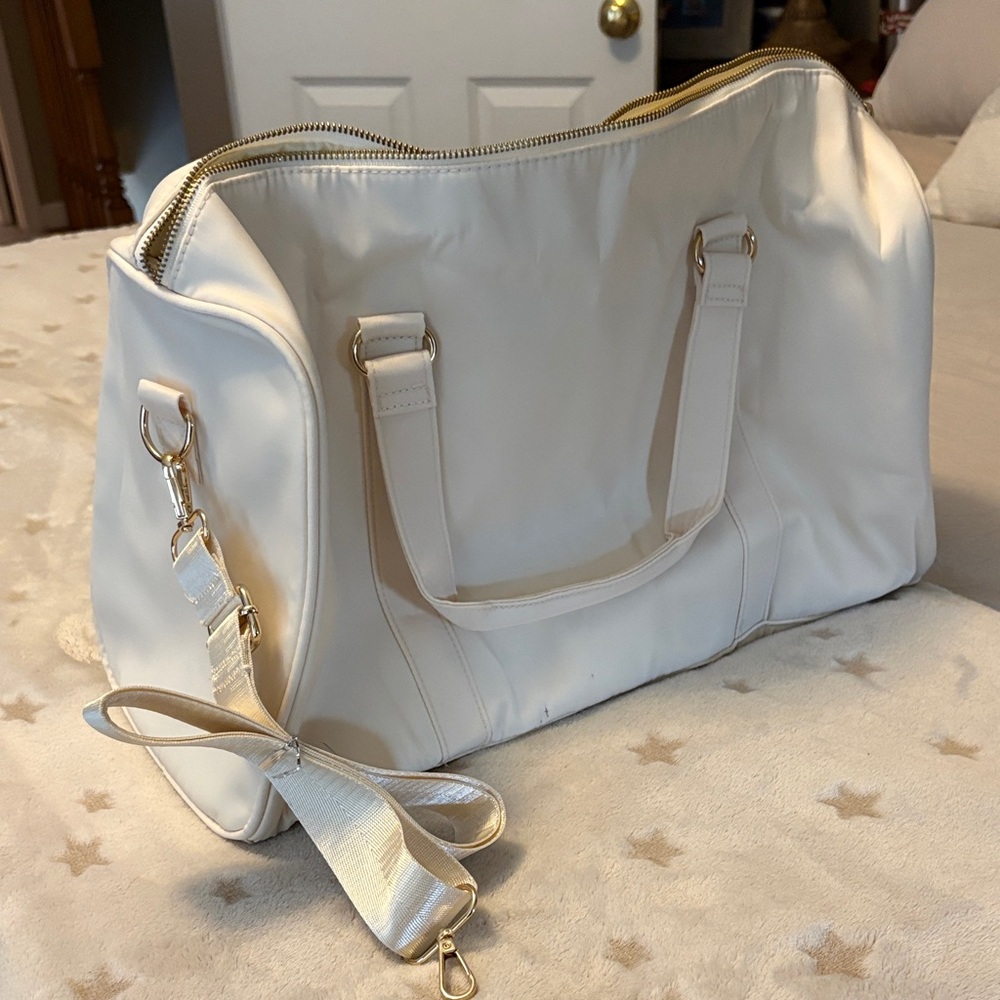Stylish Cream Travel Bag with Gold Accents
